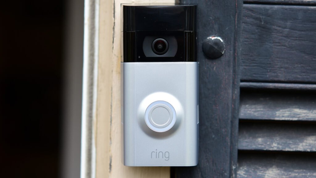 Ring video doorbell mounted beside a front door
